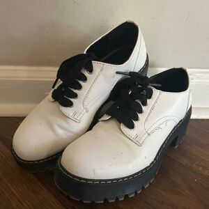 Steve Madden white and black lace up shoes.